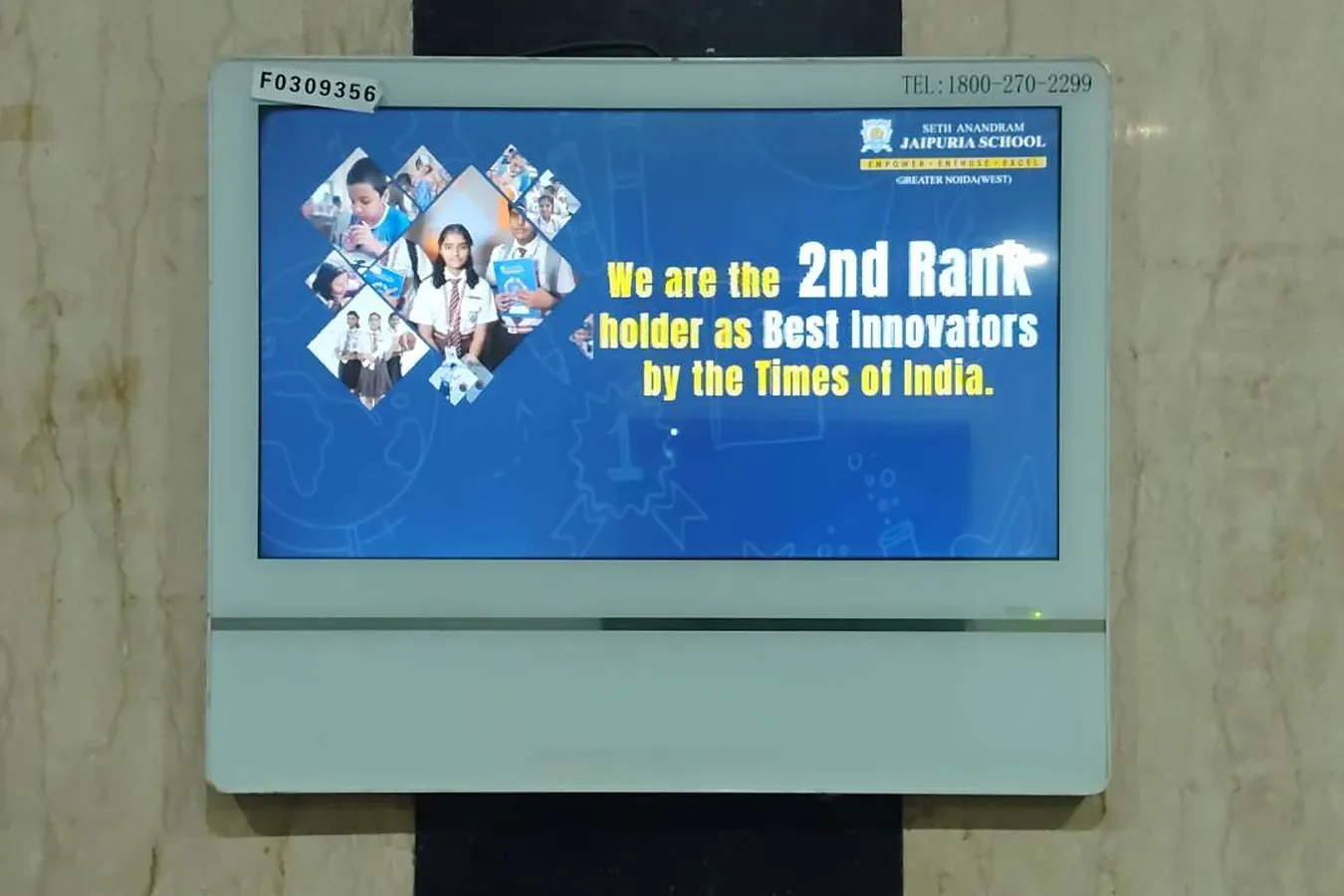 Jaipuria School ad on a digital screen inside a residential lift, by Adelite Media