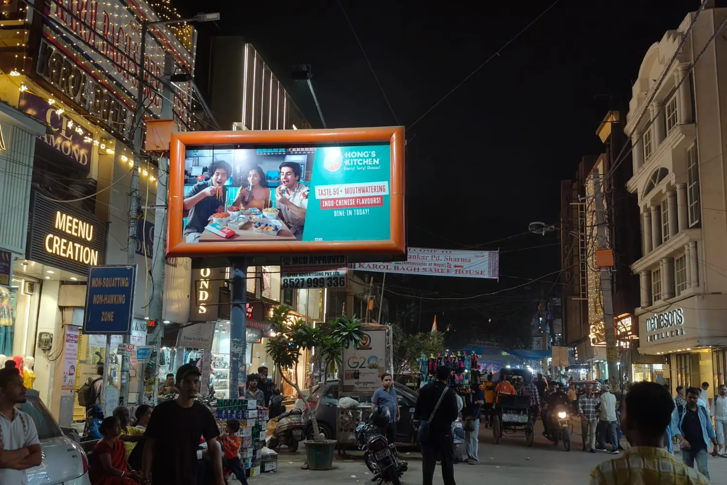 Illuminated Hong's Kitchen hoarding in Karol Bagh, outdoor advertising by Adelite Media