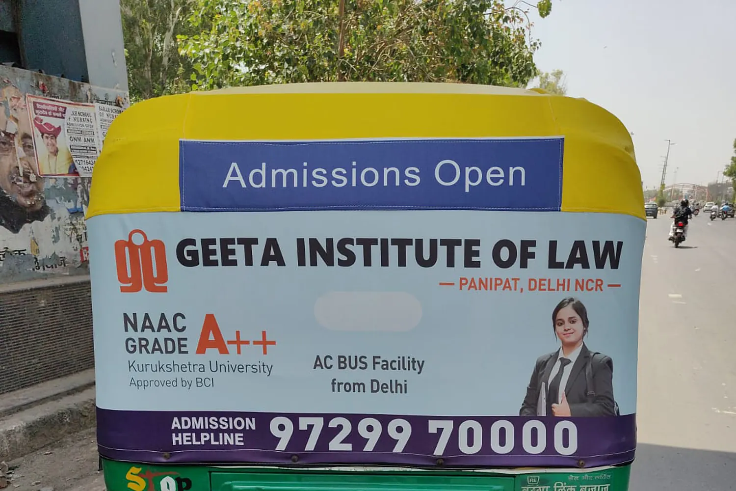 Geeta Institute of Law branding across an auto-rickshaw, transit advertising by Adelite Media