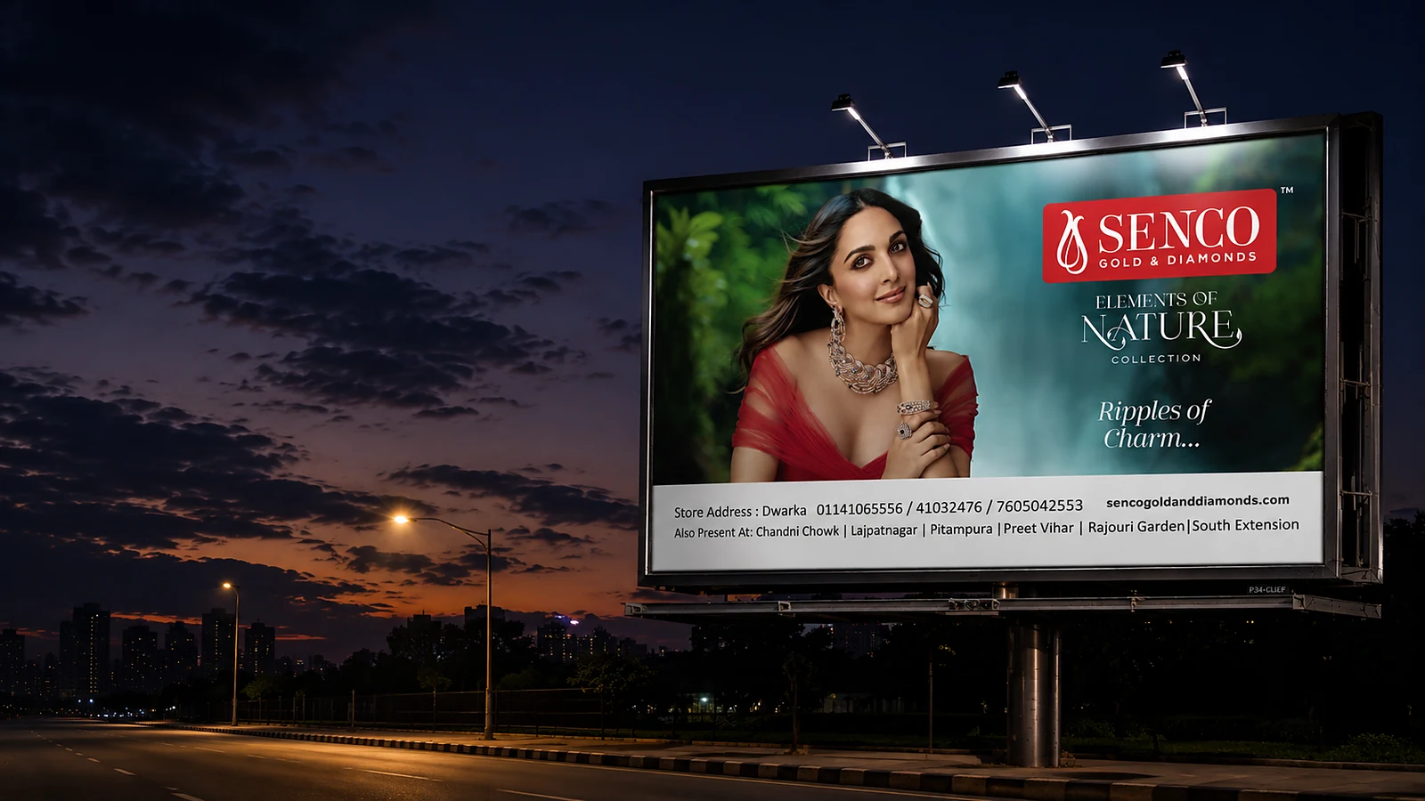 Senco Gold & Diamonds unipole hoarding lit at dusk on a Delhi arterial road, by Adelite Media
